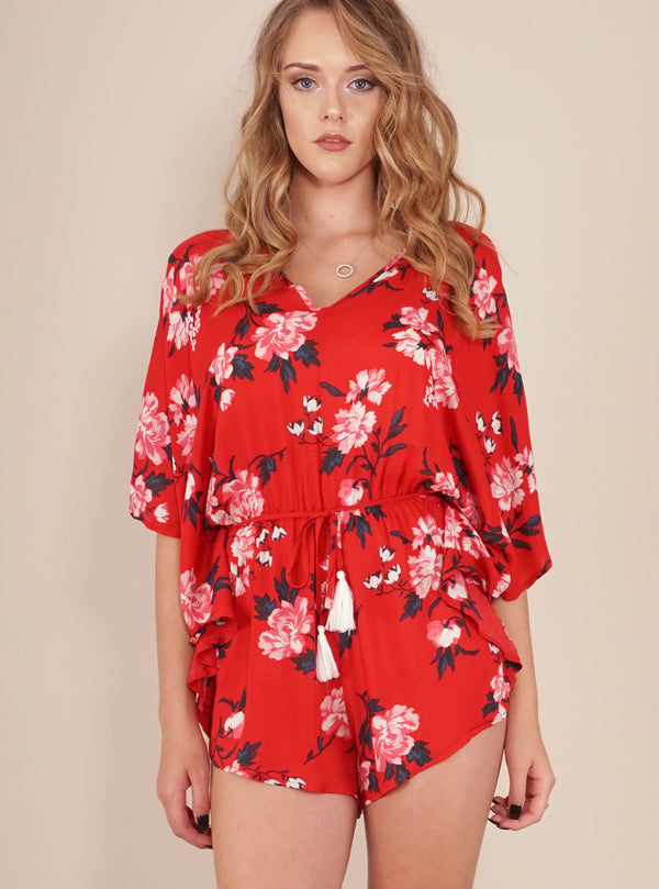 Reverse Official Playsuit, cropped front view of the Melody Playsuit in red floral.